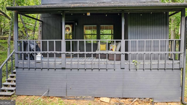 rear view of property with a porch