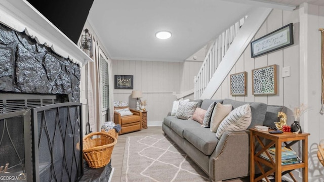 1147 Martin Dr, Cleveland, GA 30528 - living area with wood finished floors, stairs, and a fireplace with raised hearth