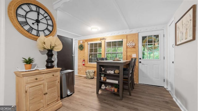 dining area featuring light wood-style floors and baseboards