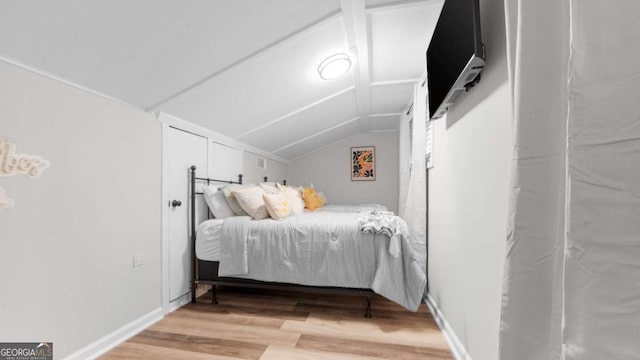 1147 Martin Dr, Cleveland, GA 30528 - bedroom featuring wood finished floors and vaulted ceiling