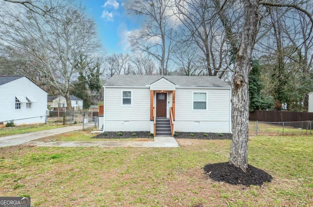 view of front of house featuring a front yard, crawl space, and fence