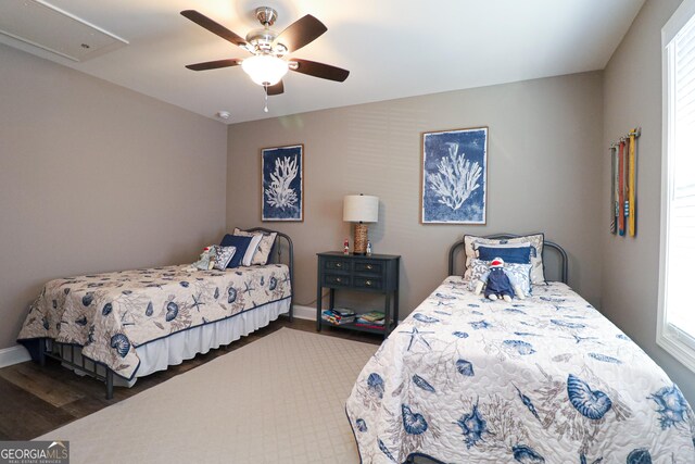 bedroom with vaulted ceiling and baseboards