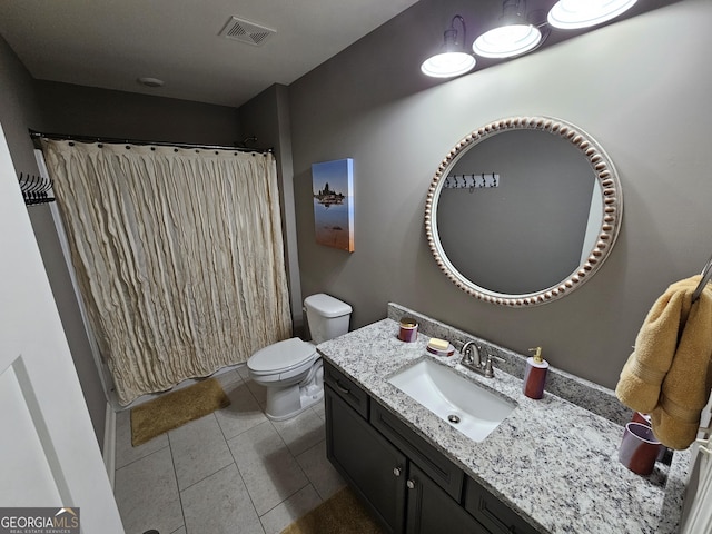 bathroom with visible vents, a shower with shower curtain, toilet, vanity, and tile patterned flooring