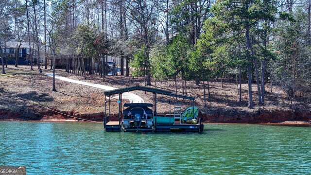 dock area with a water view and boat lift