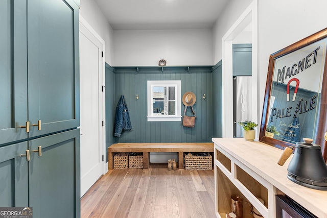 mudroom with light wood-style flooring