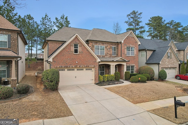 view of front of home featuring brick siding, concrete driveway, an attached garage, and a shingled roof