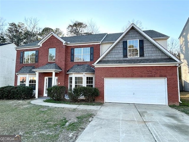 view of front facade with a garage, a front yard, concrete driveway, and brick siding