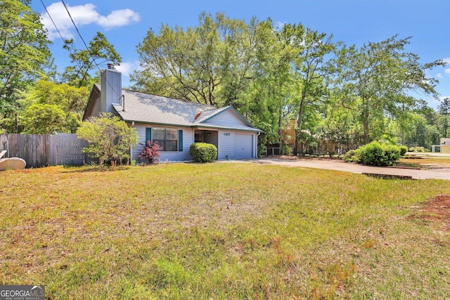 1407 Forest Lake Dr, Hinesville, GA 31313 - view of front of property with a front lawn, a chimney, concrete driveway, fence, and an attached garage