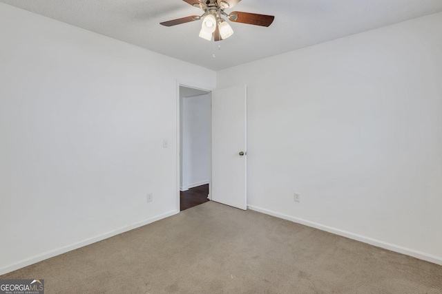 1407 Forest Lake Dr, Hinesville, GA 31313 - empty room featuring ceiling fan, carpet floors, and baseboards