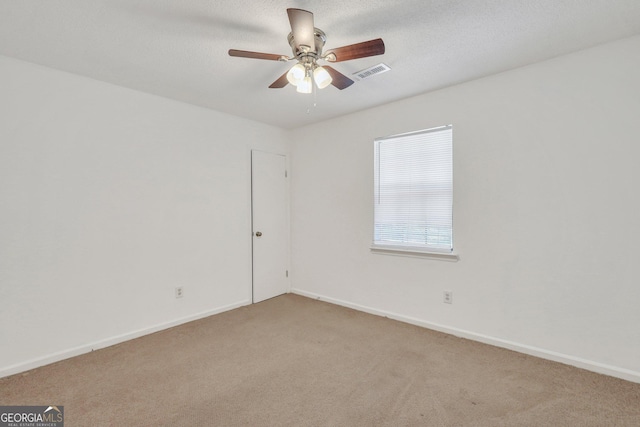 1407 Forest Lake Dr, Hinesville, GA 31313 - spare room featuring ceiling fan, baseboards, visible vents, and light colored carpet