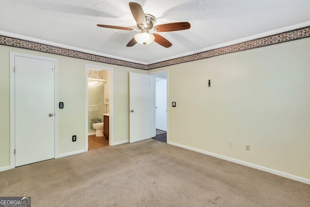 1407 Forest Lake Dr, Hinesville, GA 31313 - unfurnished bedroom with baseboards, carpet flooring, ensuite bathroom, and a textured ceiling