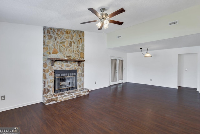 1407 Forest Lake Dr, Hinesville, GA 31313 - unfurnished living room with ceiling fan, wood finished floors, visible vents, and a fireplace