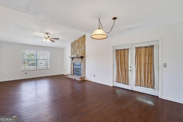 1407 Forest Lake Dr, Hinesville, GA 31313 - unfurnished living room with french doors, a ceiling fan, wood finished floors, and a fireplace