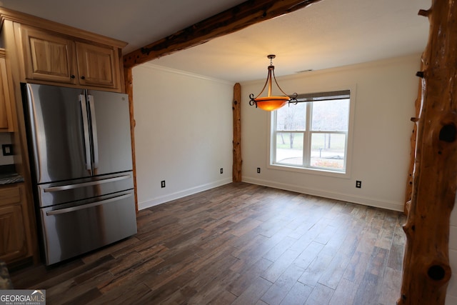 kitchen with beam ceiling, dark wood-style floors, freestanding refrigerator, crown molding, and baseboards