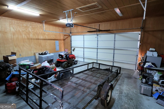 garage with electric panel, wood walls, wood ceiling, and a garage door opener