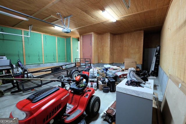 interior space with a garage door opener and wooden ceiling