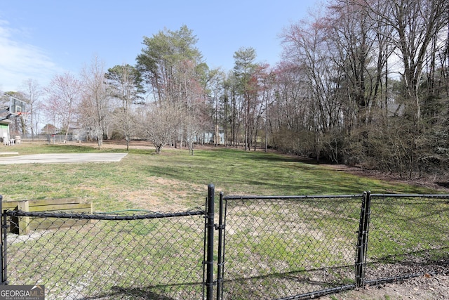 view of yard featuring a gate and fence