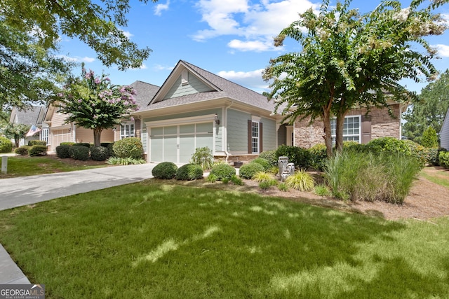 view of front of home with a shingled roof, concrete driveway, a front yard, a garage, and stone siding