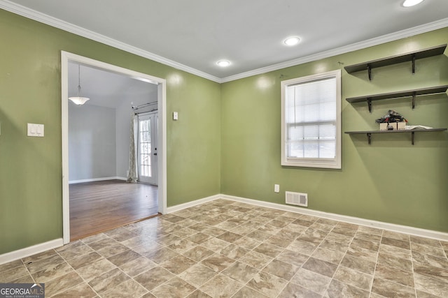 spare room featuring recessed lighting, baseboards, visible vents, and ornamental molding