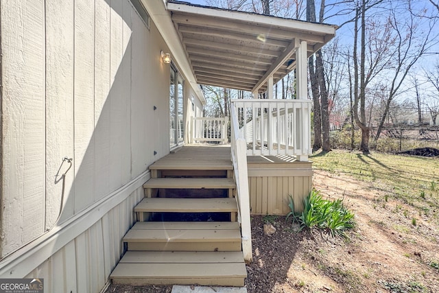 wooden terrace featuring stairs