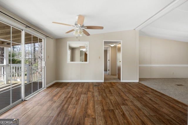 unfurnished room featuring lofted ceiling, ceiling fan, baseboards, and wood finished floors