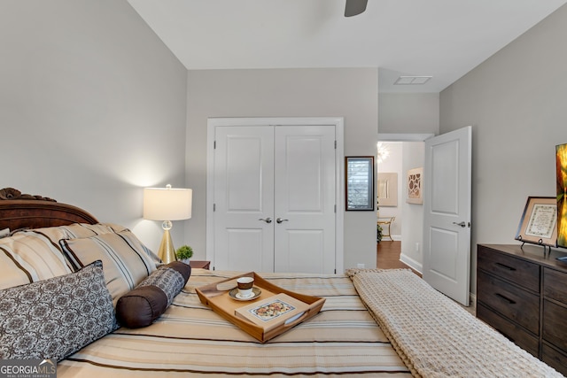 bedroom with a closet and visible vents