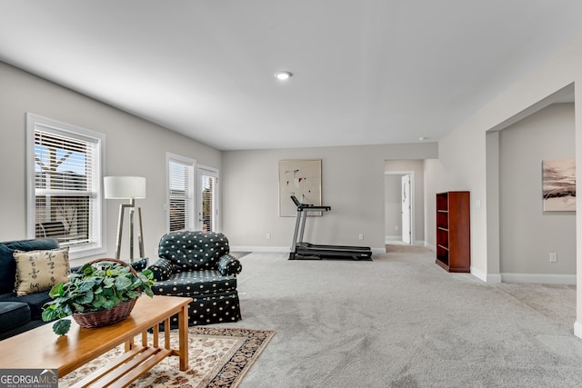 interior space with carpet flooring and baseboards