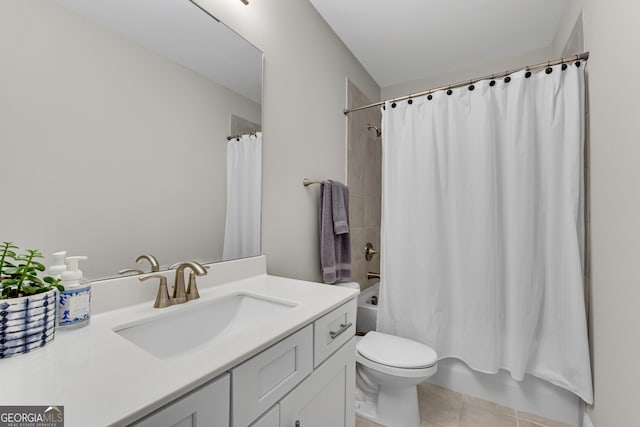 bathroom featuring toilet, vanity, shower / bath combination with curtain, and tile patterned floors