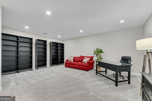 home office with recessed lighting, visible vents, baseboards, and light colored carpet