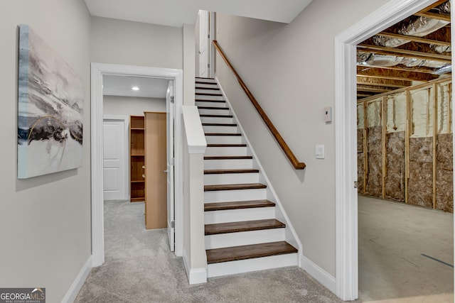 stairway with carpet flooring and baseboards