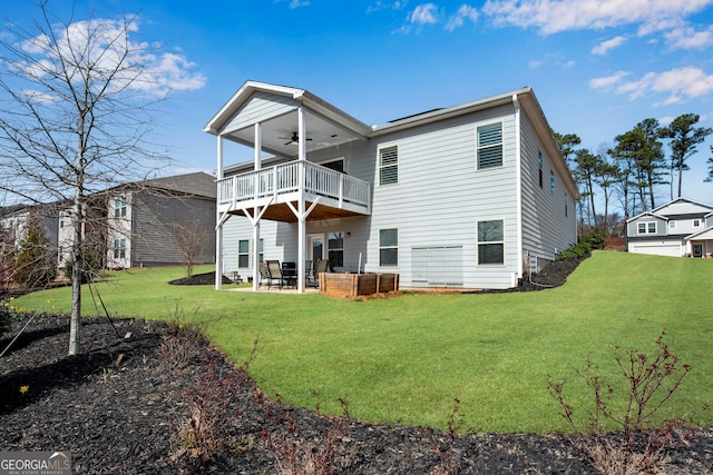 back of property featuring a yard, ceiling fan, and a patio