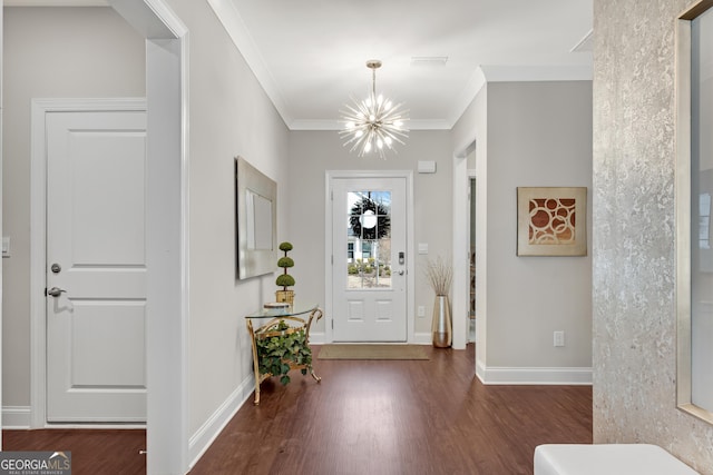 entryway with a chandelier, crown molding, baseboards, and wood finished floors