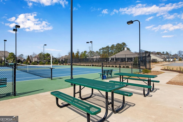 view of sport court with fence