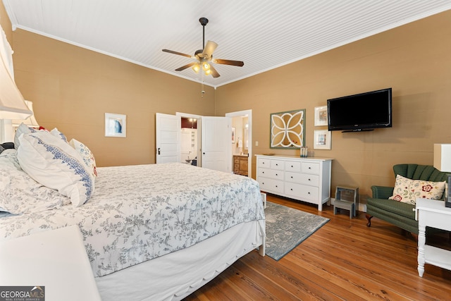 bedroom featuring ornamental molding, ceiling fan, and wood finished floors