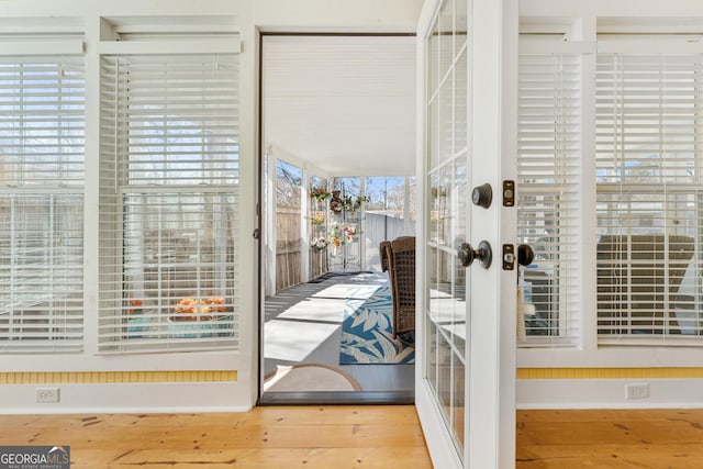 doorway to outside featuring wood-type flooring and french doors