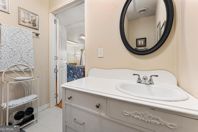 bathroom with vanity and tile patterned floors