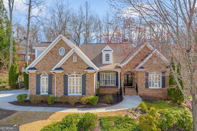 traditional-style house featuring brick siding