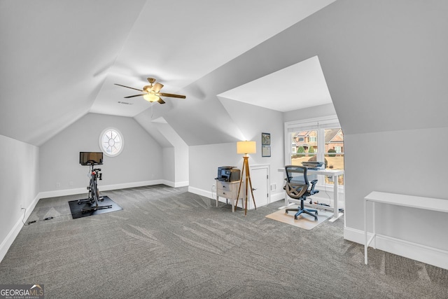 exercise area featuring ceiling fan, baseboards, lofted ceiling, and carpet