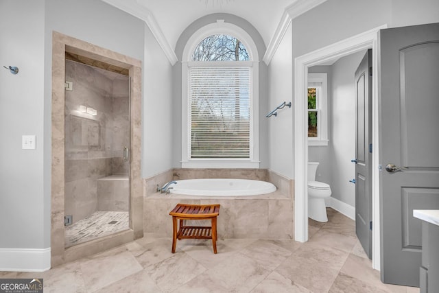 full bathroom with baseboards, a stall shower, toilet, and a garden tub