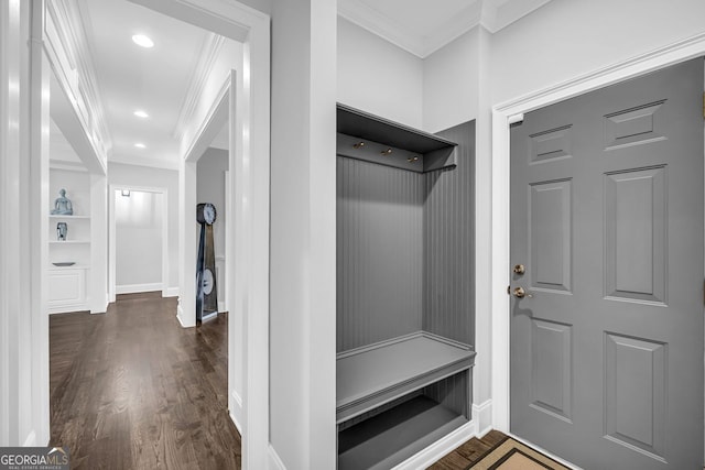 mudroom featuring dark wood-type flooring, baseboards, and ornamental molding