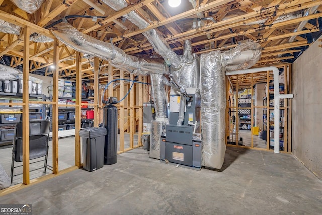 unfinished basement featuring gas water heater