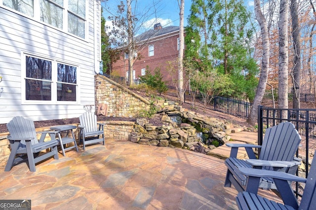 view of patio / terrace featuring fence