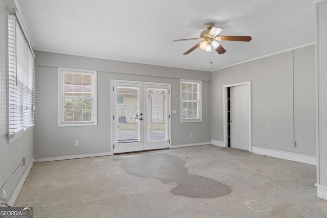 empty room with french doors, crown molding, baseboards, and ceiling fan