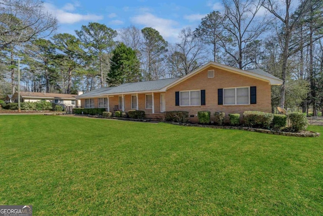 single story home featuring crawl space, a front lawn, and brick siding