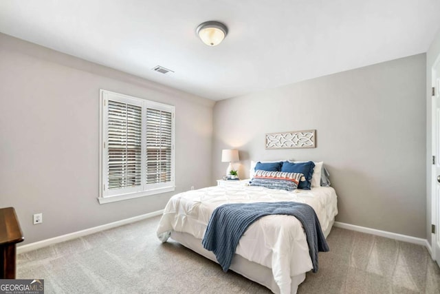 bedroom featuring visible vents, baseboards, and carpet flooring