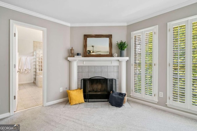 living area featuring a fireplace, carpet flooring, and a wealth of natural light