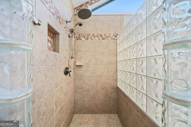 bathroom with a tile shower