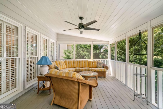 sunroom / solarium with a ceiling fan, lofted ceiling, wood ceiling, and plenty of natural light