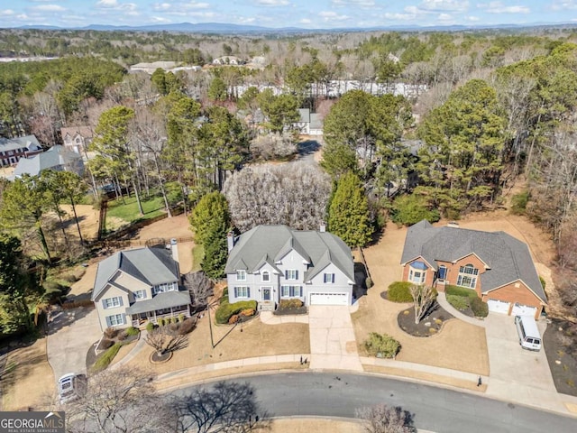 bird's eye view featuring a residential view and a view of trees