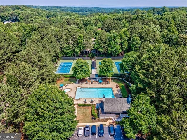 aerial view featuring a wooded view